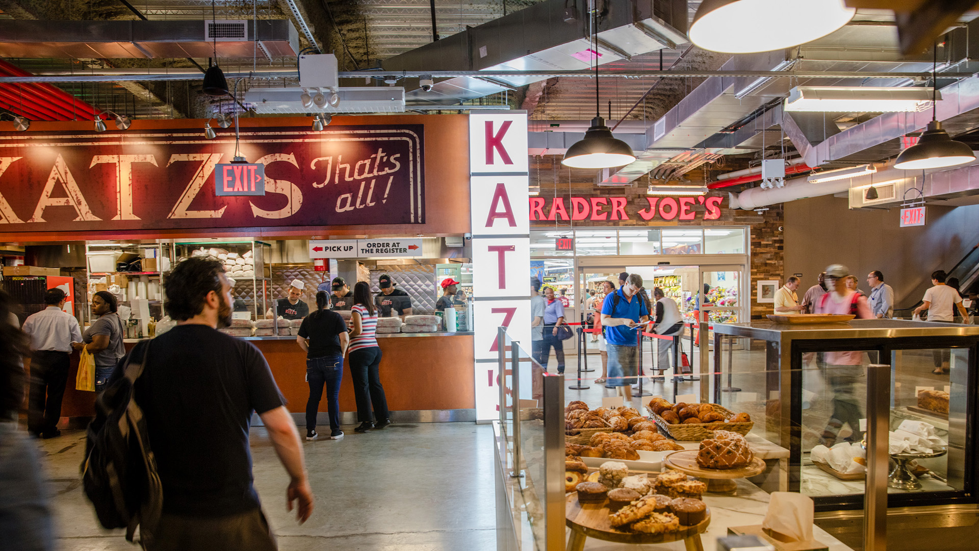 Inside Dekalb Market Hall - Katz Delicatessen, Trader Hoes, a kiosk with pastries 